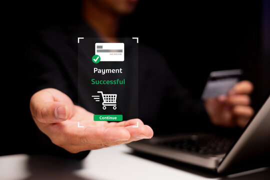 A hand holding a digital payment confirmation with "Payment Successful" displayed, indicating a successful online transaction.