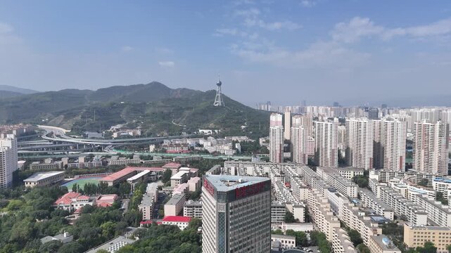 Aerial View of Xining City, Qinghai Province with Tower and Mountains