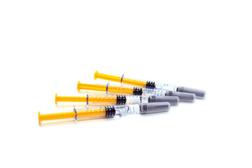 Pile of syringes isolated on white background. Self-injections anticoagulant therapy preventing blood 
clots. Prevention of Postpartum thrombophlebitis.
