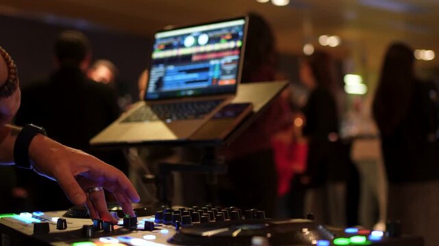 DJ Mixing Music at a Night Club Event