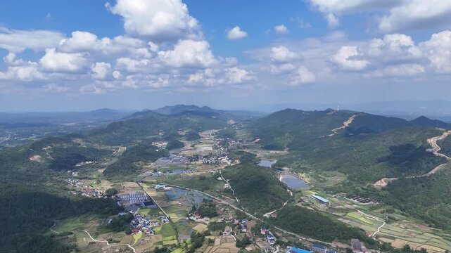 Aerial View of Rice Paddies and Mountains in Rural Farmland