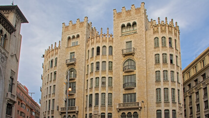 Ornate neoclassical building with towers in Barcelona, Spain 