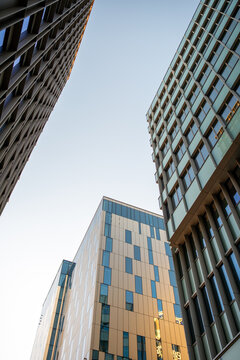 A facade shaped by reflection and perspective defines urban architecture in Hagastaden, elevating Stockholm buildings within a skyline driven by coherent contemporary design themes