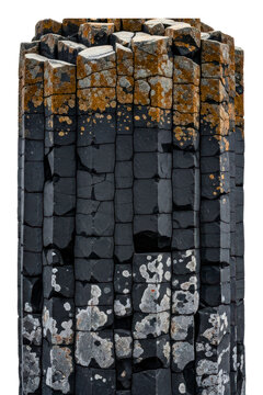 Vertical basalt columns with textured rock surface and lichen isolated on transparent background