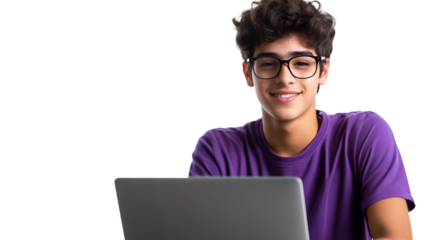 Smiling young male student with dark curly hair and glasses wearing a purple shirt sitting in front of a laptop isolated on transparent background