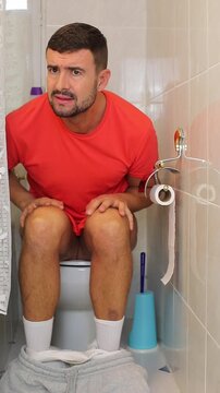Funny comedic man getting caught in the toilet seat