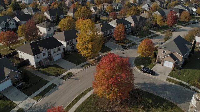 Aerial View of Suburban Neighborhood in Autumn Colors.