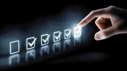 Hand selecting the last glowing checkbox in a row of marked squares symbolizing task completion and success on a dark futuristic digital interface background