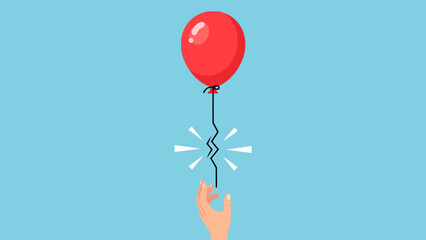 Red balloon with broken string above a hand