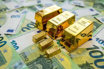Euro notes and gold bullion showing economic value, currency market and investment balance