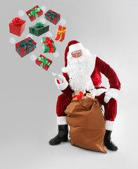 Santa Claus levitating gift boxes and snowflakes on light grey background. Christmas magic