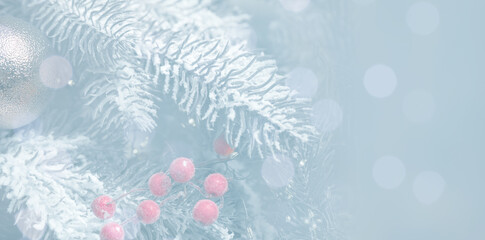 Christmas greeting card with fir tree branches and bokeh lights. Banner design