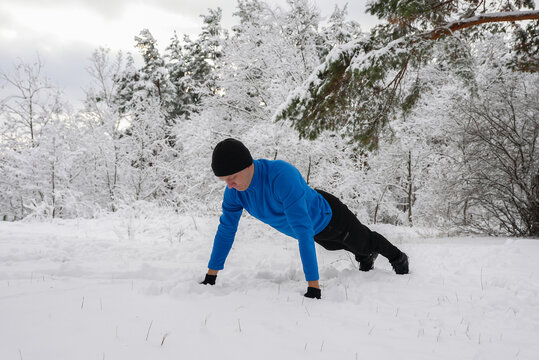 Man exercising outdoors on a snowy winter day