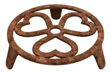 Rusty cast iron trivet stand with decorative clover leaf design isolated on a transparent background