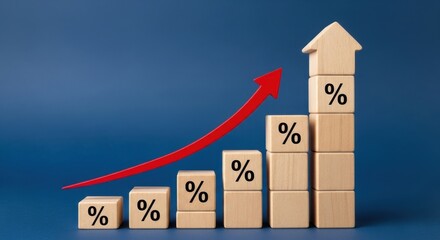 Wooden block chart showing rising percentage rate with red arrow