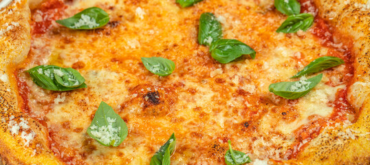 Freshly baked Margherita pizza with golden melted cheese, tomato sauce, and vibrant basil leaves, captured in a delicious close-up ideal for food menus, restaurant promotions, and culinary advertising