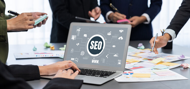 Analyst team use sticky note for creative and analytic brainstorm for business idea with BI data dashboard on laptop screen. Analysis financial data visualization tech for marketing strategy. Prodigy - Powered by Adobe