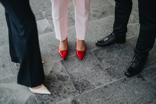 A group of professionals stands in a circle, highlighting fashion-forward footwear.