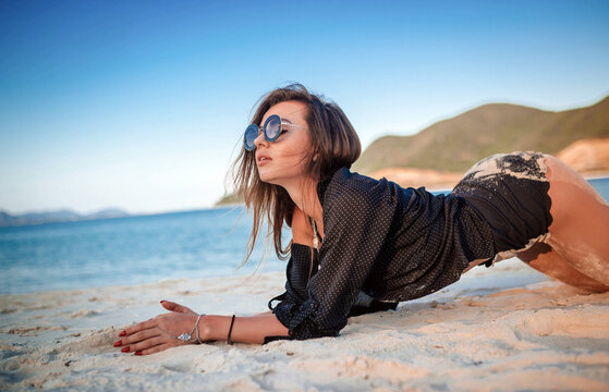 Woman relaxing on a sunny beach at Vinpearl