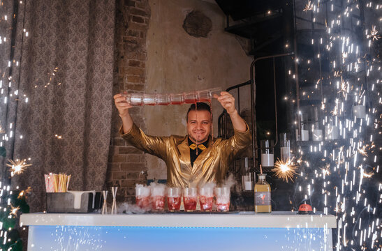 Bartender performing flair cocktail show with sparkles