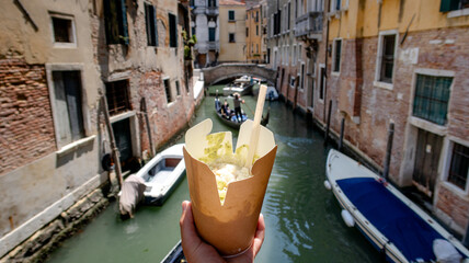 Pasta to go with view of Venetian canal and gondolas