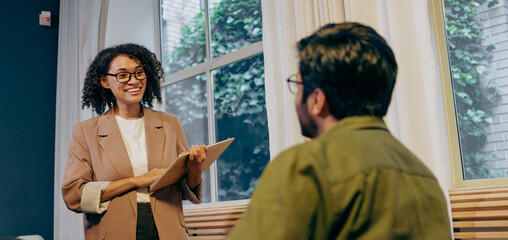 sales professional thoroughly presents detailed strategy while client actively engages during meeting