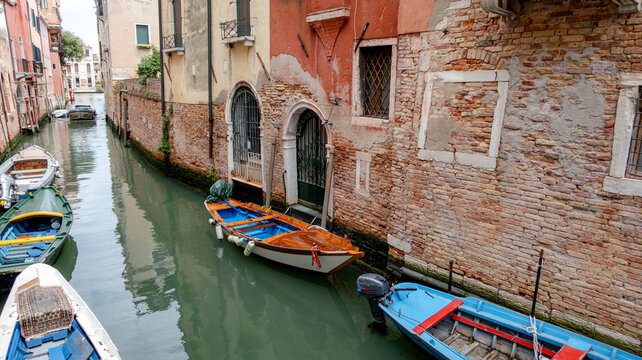 Homeowners' boats on a peaceful Venetian canal