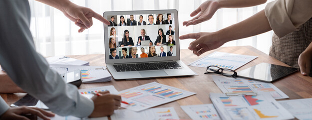 Business people on video conference for brisk virtual group meeting of corprate business office...
