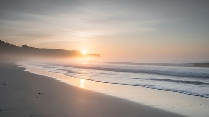 Serene beach at sunrise with misty fog rolling in from the ocean and soft golden light coast