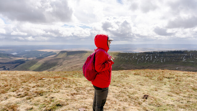 Woman exploring Brecon Beacons National Park landscape