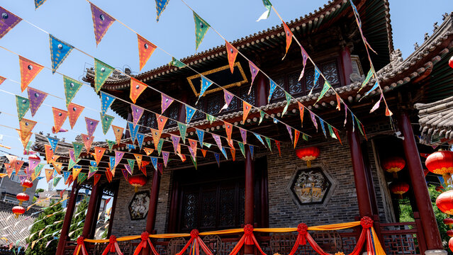 Traditional temple decorated with colorful flags