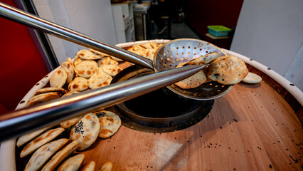 Shaobing baking process in traditional tandoor oven