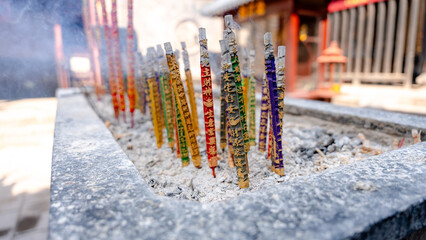 Colorful incense sticks in Cheng Huang temple altar