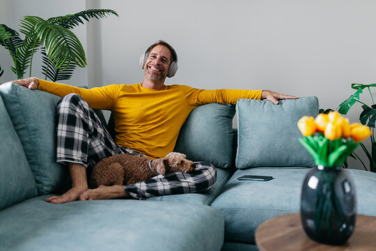 Relaxed man in pajamas enjoying leisure time at home