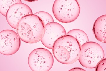 Pink translucent spheres with internal bubbles floating in liquid, ideal for beauty campaigns, cosmetic science visuals, and soft modern abstract design use