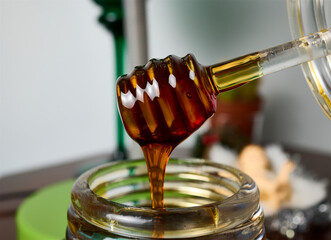 Honey. Glass honey dispenser for serving honey without spills.