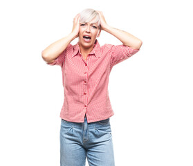 Panicked adult woman with open mouth stare to you with popped eyes, isolated on white background. Scared middle aged woman. Unbelievable concept.