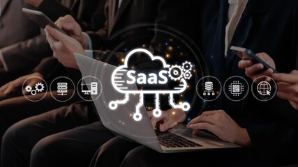 Team members engage with mobile devices and a laptop, exploring Software as a Service concepts. Technology icons symbolize cloud computing and digital evolution. Raster