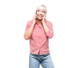 Ecstatic adult woman talks on the smartphone, isolated on white background. Pleased amazing middle aged woman using the mobile phone.