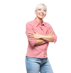 Portrait of positive adult woman with crossed arms, isolated on white background. Cheerful middle aged woman looking to camera. Copy space.