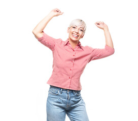 Excited adult woman at winner, isolated on white background. Yes concept. Good news. Copy space. Pretty middle aged woman celebrates success.
