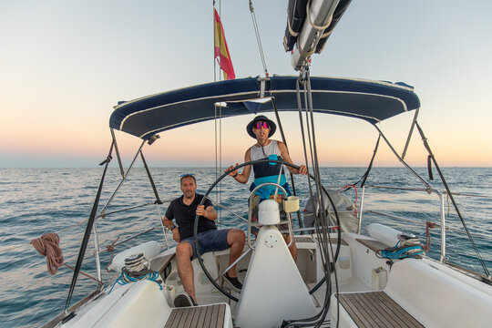Friends enjoying a sailing adventure in the Mediterranean