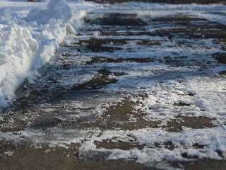 low angle view of a plowed driveway or concrete surface with copy space. winter holiday or season background. transportation or infrastructure.. Winterdienst backdrop. Winterdienst backdrop. 