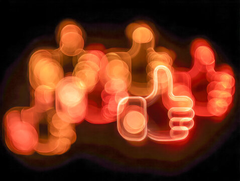 Vibrant glowing thumbs up symbols with light trails creating a bokeh effect on a dark background symbolizing positivity and social approval concepts