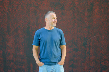 Mature man standing casually outdoors