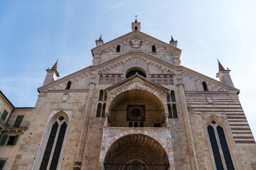 Verona Cathedral's impressive facade against a clear blue sky.
