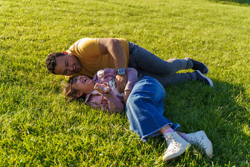 Father and daughter enjoying a sunny day in the park
