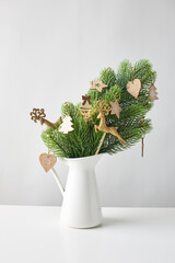 Christmas arrangement in a vase, a bouquet of fir branches and decorative Christmas ornaments