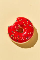 Overhead view of Delicious donut on colored background