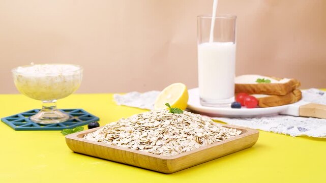 Raw Oats in Wooden Tray with Milk Glass for Healthy Breakfast Preparation